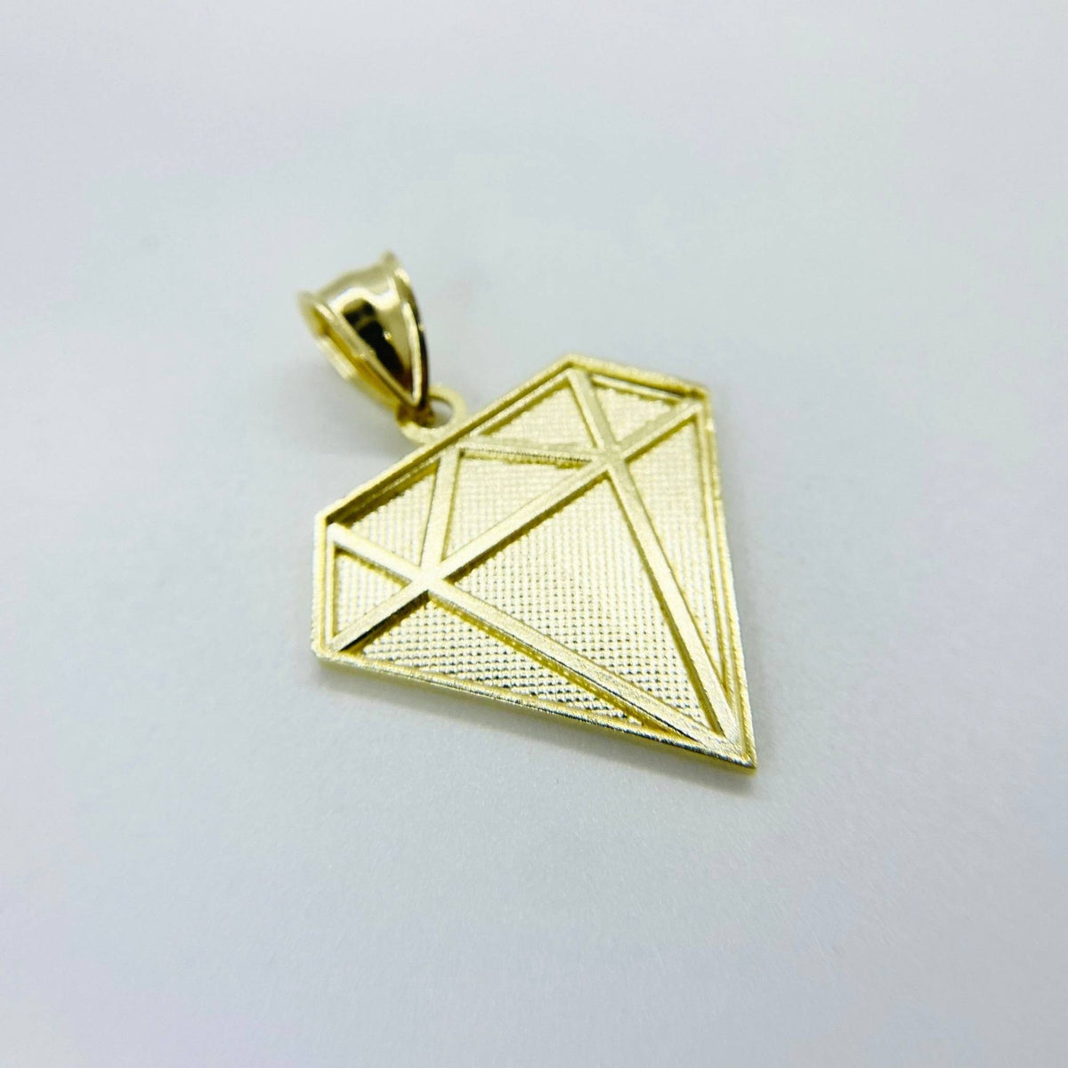 Back view of 10k gold diamond-shaped pendant showing hollow reverse setting.
