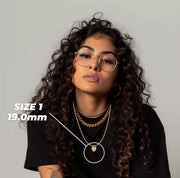 Woman wearing Size 1 19.0mm gold dripping heart pendant necklace with size callout overlay.