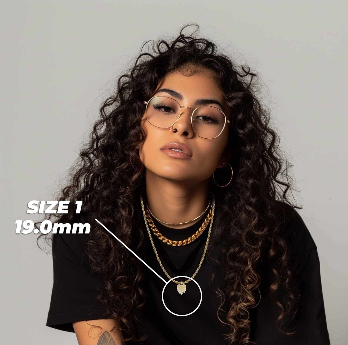 Woman wearing Size 1 19.0mm gold dripping heart pendant necklace with size callout overlay.