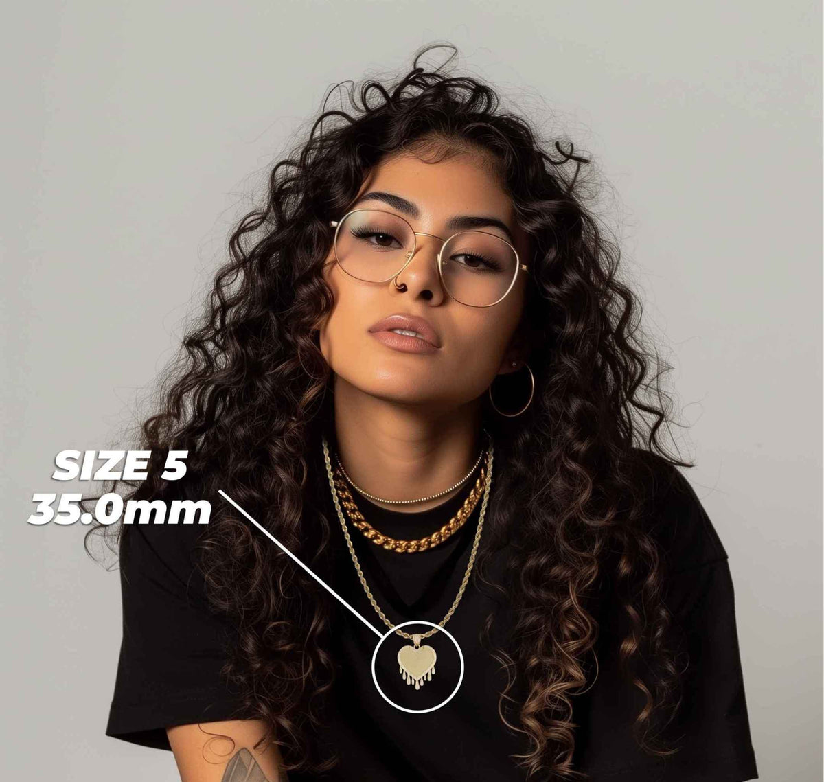 Woman wearing Size 5 35.0mm gold dripping heart pendant necklace with size callout overlay.