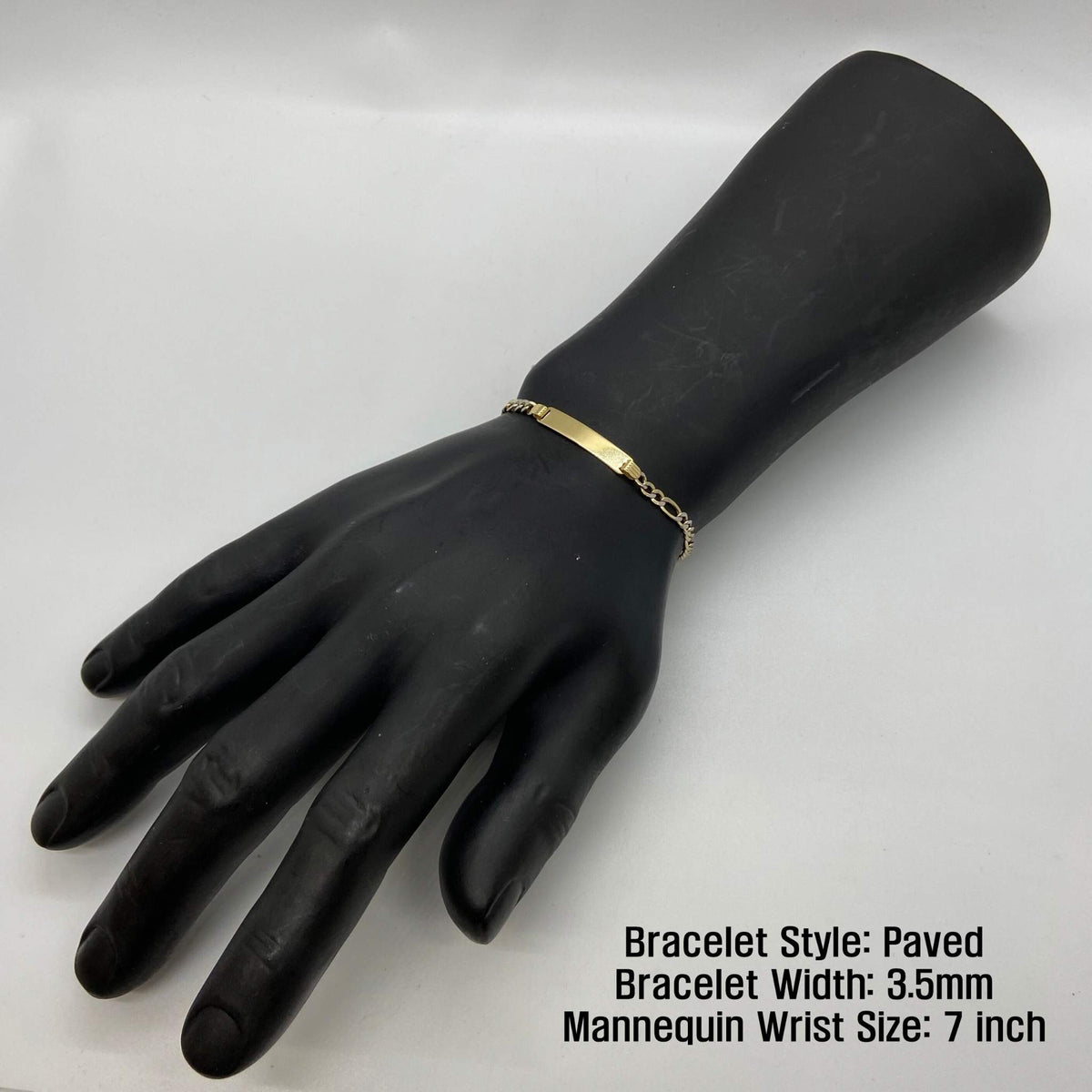 Paved 3.5mm gold Figaro ID bracelet shown on a 7-inch mannequin wrist.