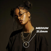 Model wearing Medium 21.0mm gold filigree puff heart pendant necklace with size graphic.