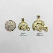 Size comparison of small 25.7mm and medium 33.4mm gold football helmet pendants next to a quarter
