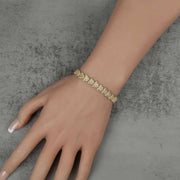 Model wearing a 10k gold Forev nugget butterfly link bracelet on their wrist.