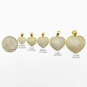 Size comparison of five 10k gold Frida convex heart CZ pendants next to a quarter.