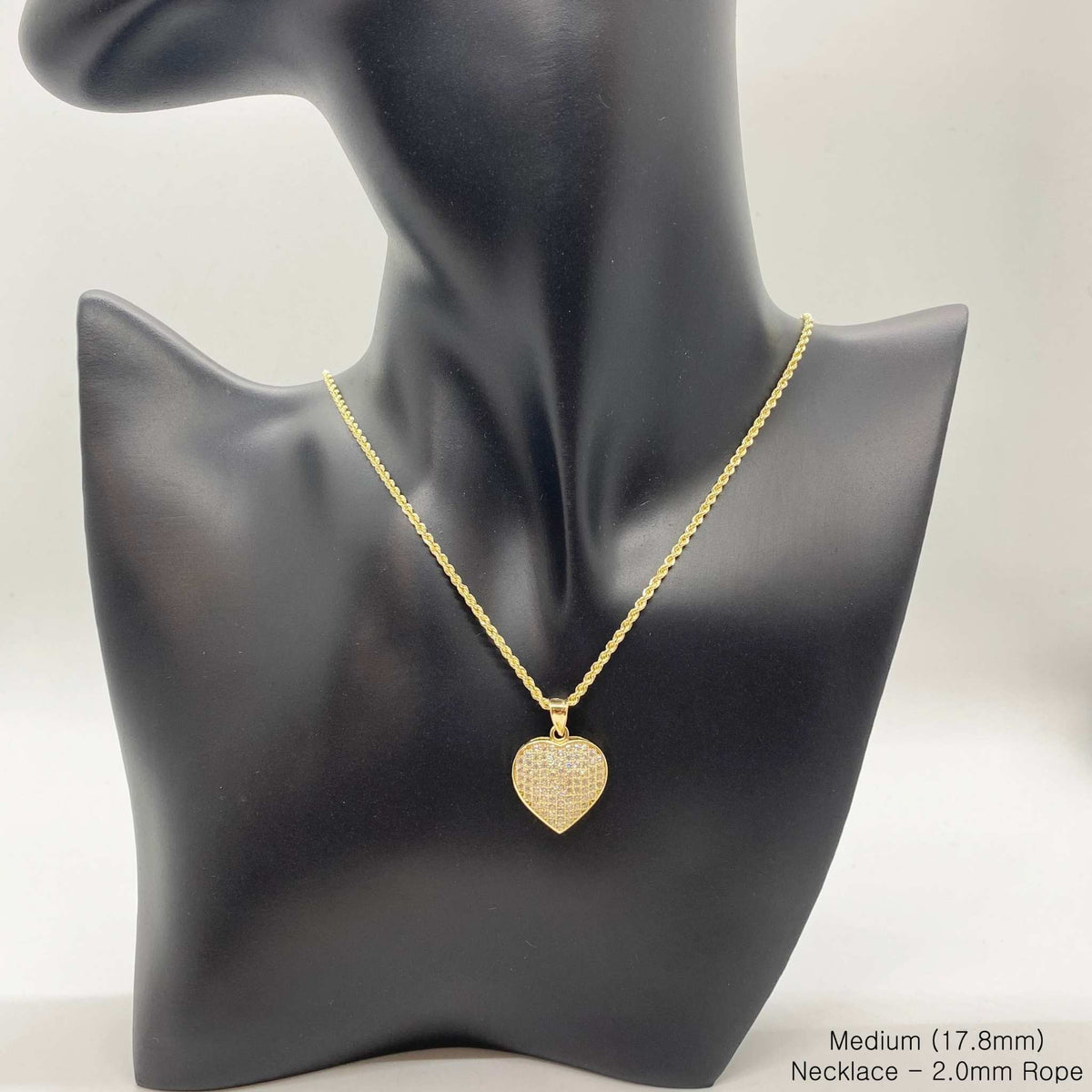 10k yellow gold iced-out Frida heart pendant necklace displayed on a black jewelry bust.
