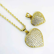 Pair of 10k gold iced-out Frida convex heart pendants featuring clear pavé CZ stones