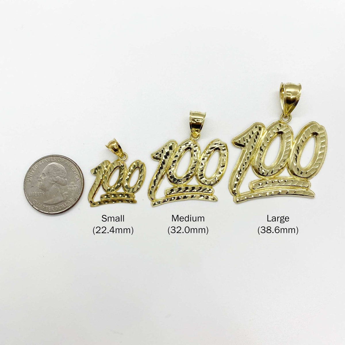 Three gold 100 emoji pendants in small, medium, and large next to a quarter.