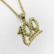 Diamond-cut 10k yellow gold 100 emoji pendant on a matching rope chain.