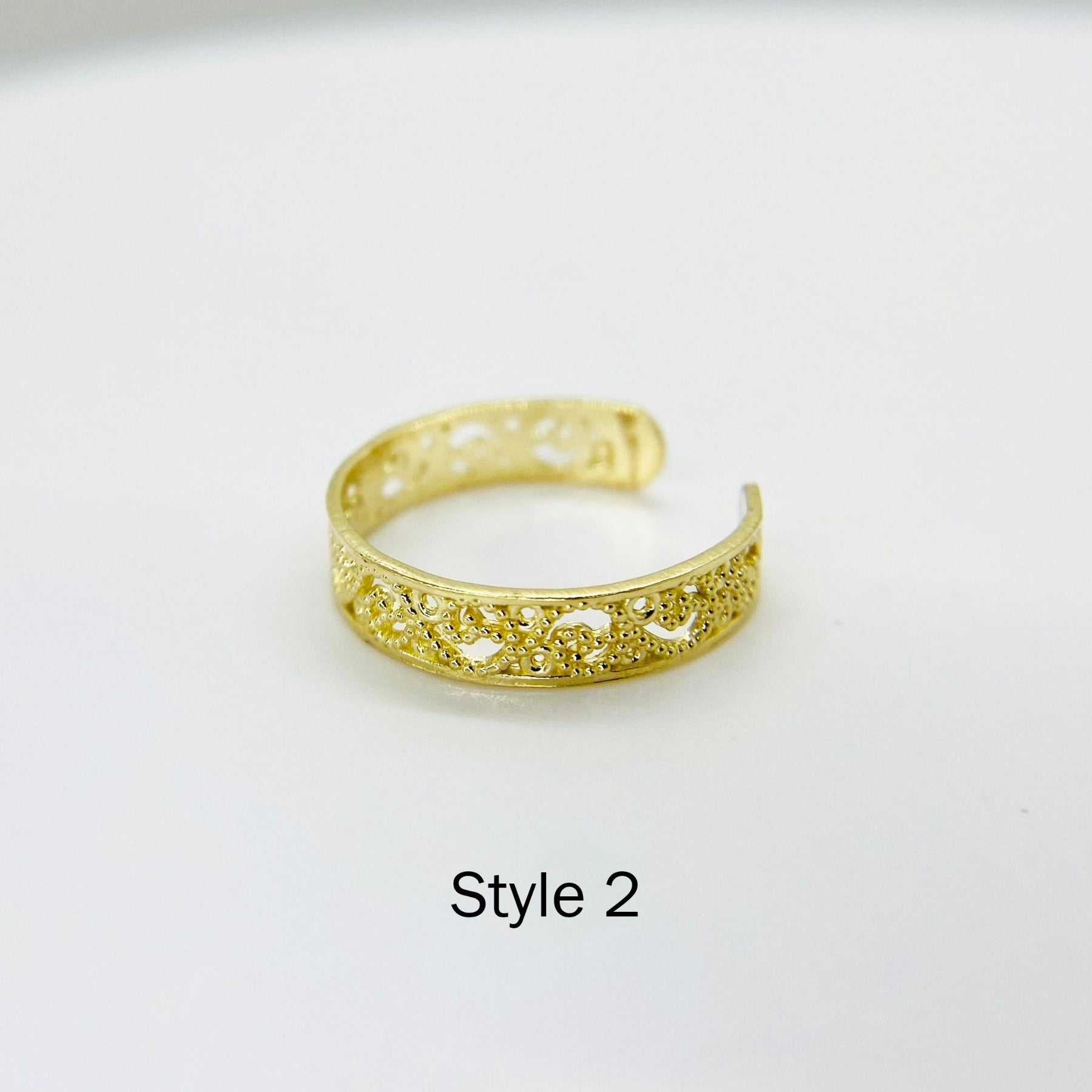 10k Gold Dainty Toe Ring with intricate design on a white background