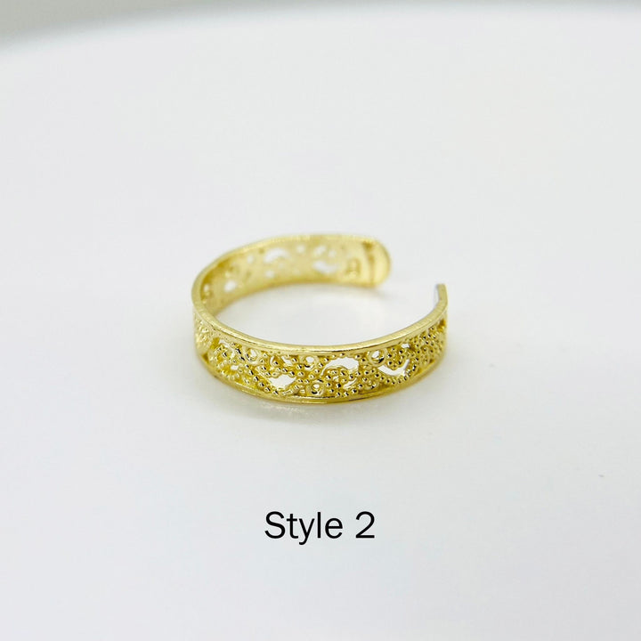 10k Gold Dainty Toe Ring with intricate design on a white background