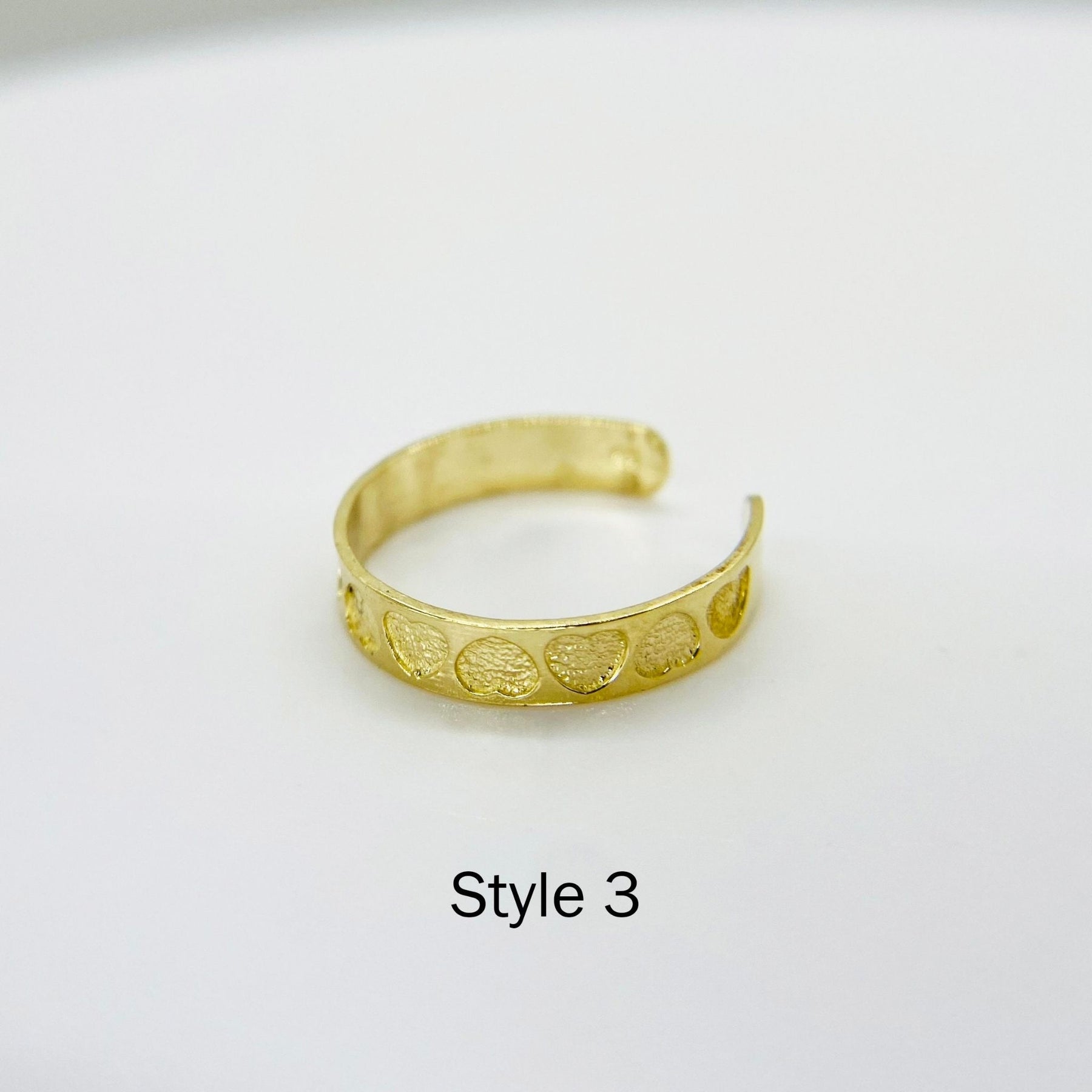 10k Gold Assorted Dainty Toe Ring with embossed design on a white background