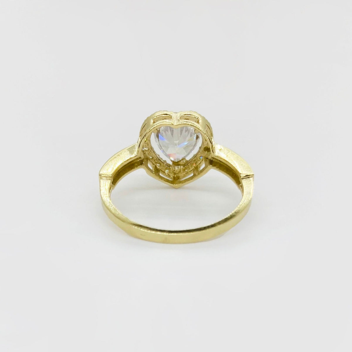10k Gold ring with a heart-shaped cubic zirconia back view on a white background
