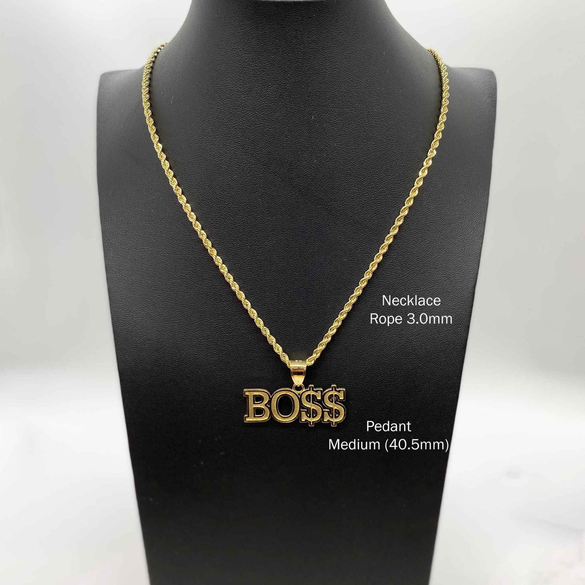 Medium 40.5mm 10k gold "BOSS" pendant necklace displayed on a black jewelry bust.