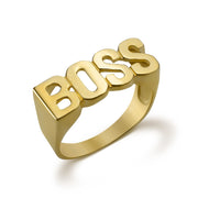 10k yellow gold ring with block letters spelling BOSS on white background.