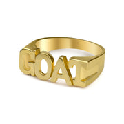 Angled view of a 10k gold GOAT block letter ring on white background.