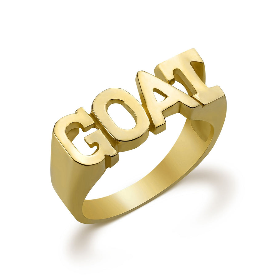 10k yellow gold ring with block letters spelling GOAT on white background.