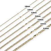 Seven 10k gold mariner chains arranged diagonally by width with size labels on white