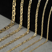 Six 10k gold mariner chain necklaces of varying widths displayed on a black background