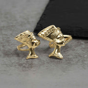 Two 10k gold classic Nefertiti profile rings displayed on a gray stone surface.