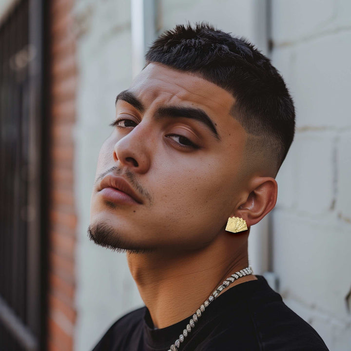 Man wearing 10k gold Royal Flush playing card stud earrings.