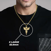 A man wearing an X Large gold angel pendant labeled X LARGE 52.0mm.