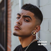 Male model wearing medium 18.0mm 10k gold praying hands stud earrings.