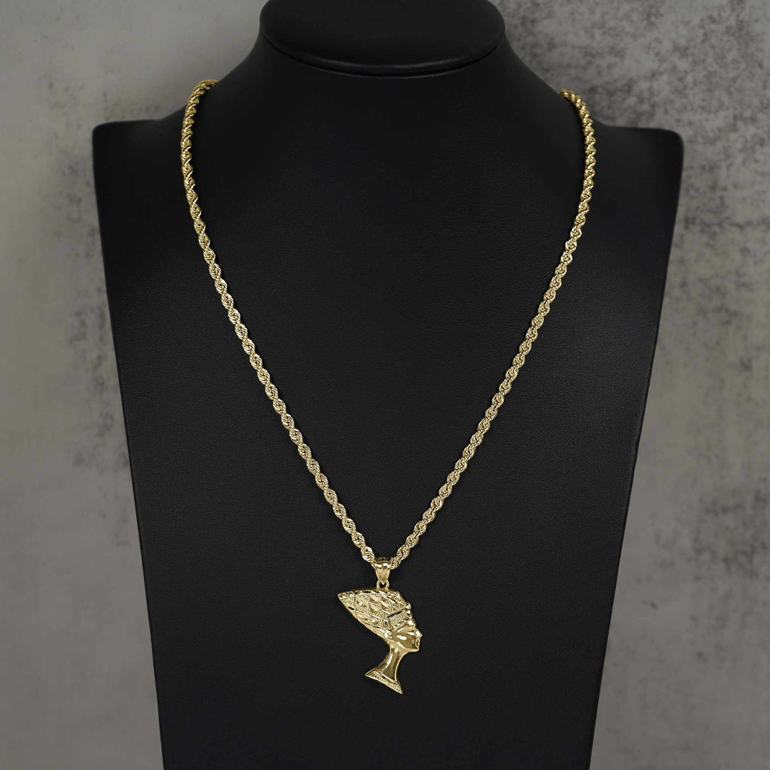 Polished 10k gold Queen Nefertiti pendant hanging on a rope chain, displayed on a bust.