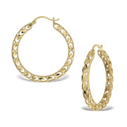 A pair of 10k yellow gold round Turkish hoop earrings featuring an intricate satin-finish pattern.