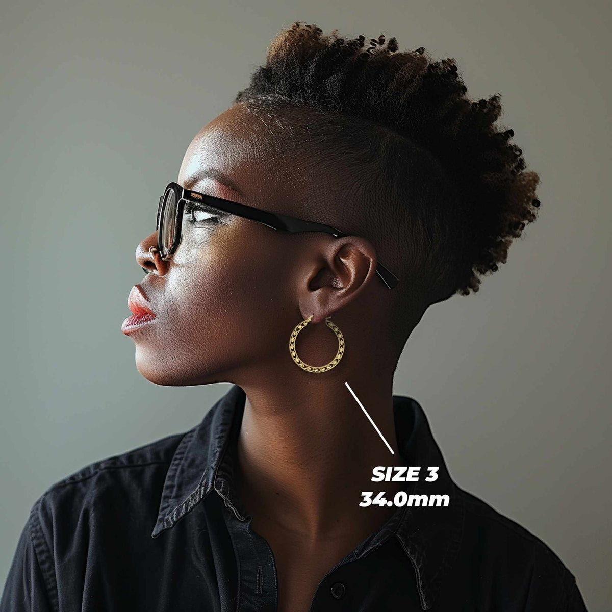 Profile view of a model wearing 34mm 10k gold Turkish hoop earrings for scale.