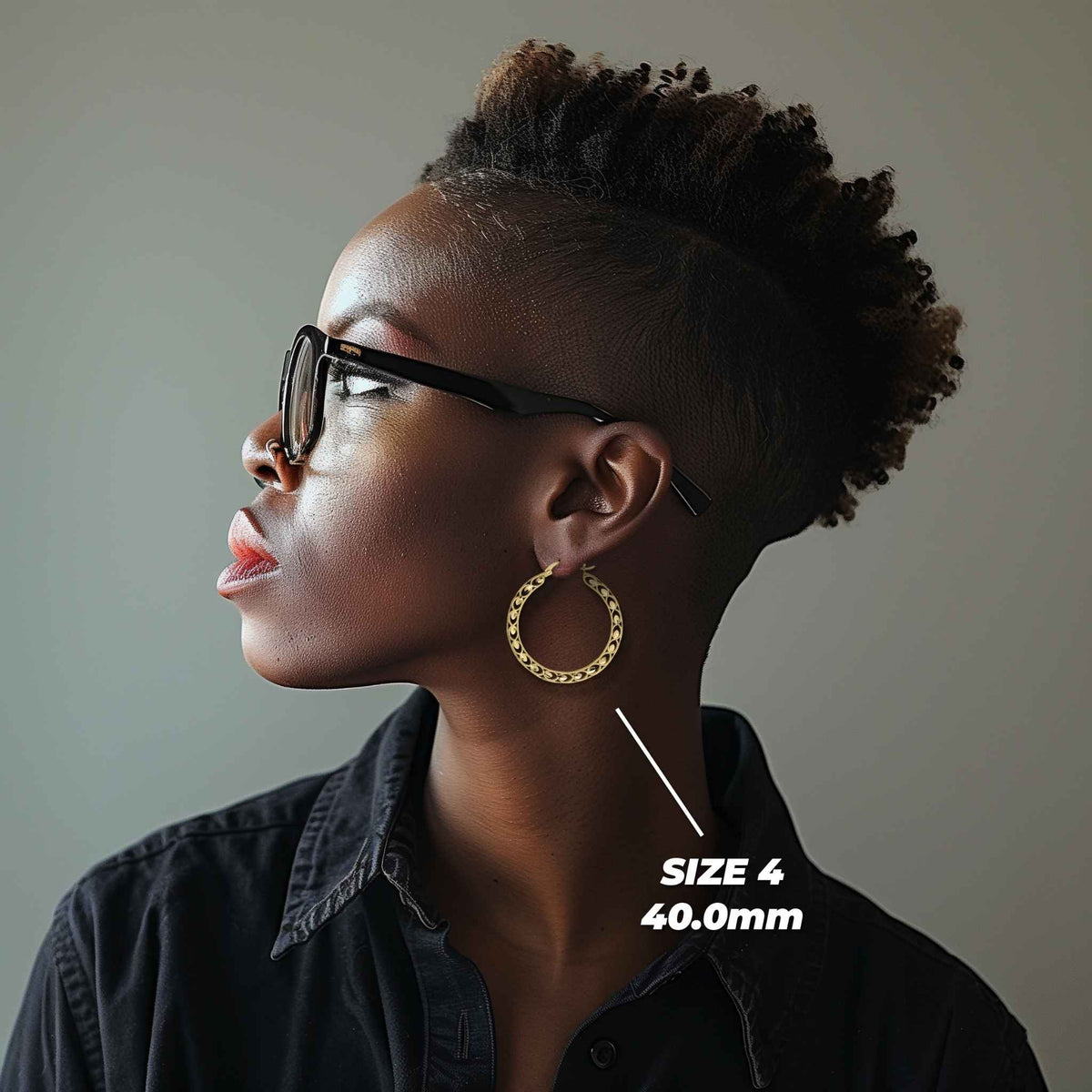 Profile view of a model wearing 40mm 10k gold Turkish hoop earrings for scale.