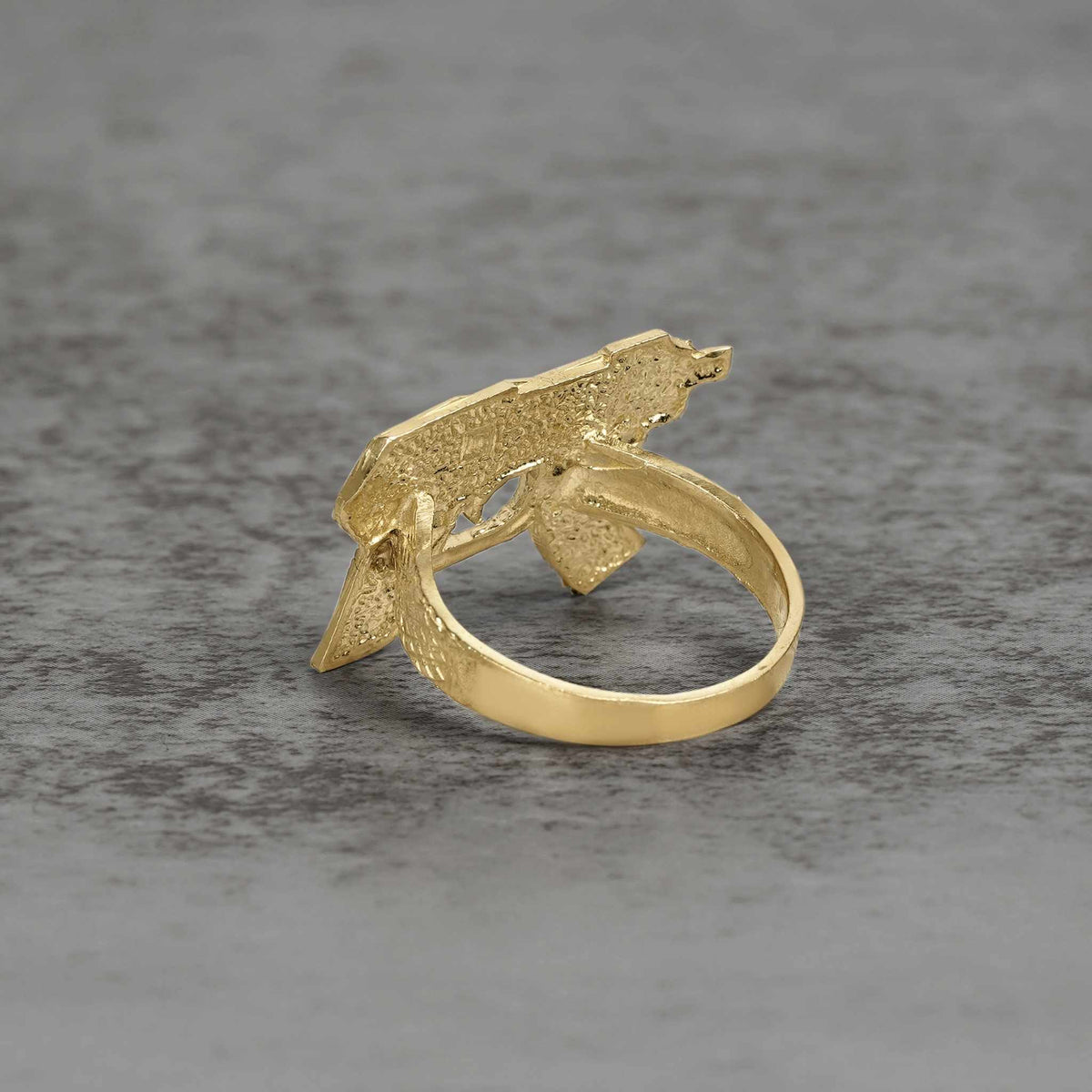 Back view of a 10k gold classic Uzi ring showing the inner band on stone.