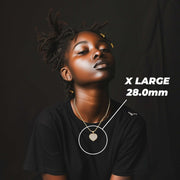 Model wearing the X Large gold heart necklace with size measurements.