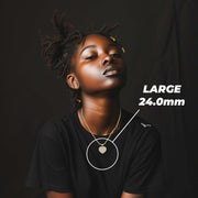 Model wearing the Large gold heart necklace with size measurements.