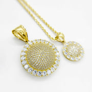 10k yellow gold convex round CZ pendants shown in medium and small sizes.