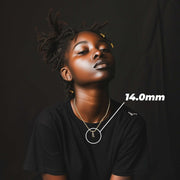 Model wearing the 10k gold cursive initial pendant with a 14.0mm size overlay.