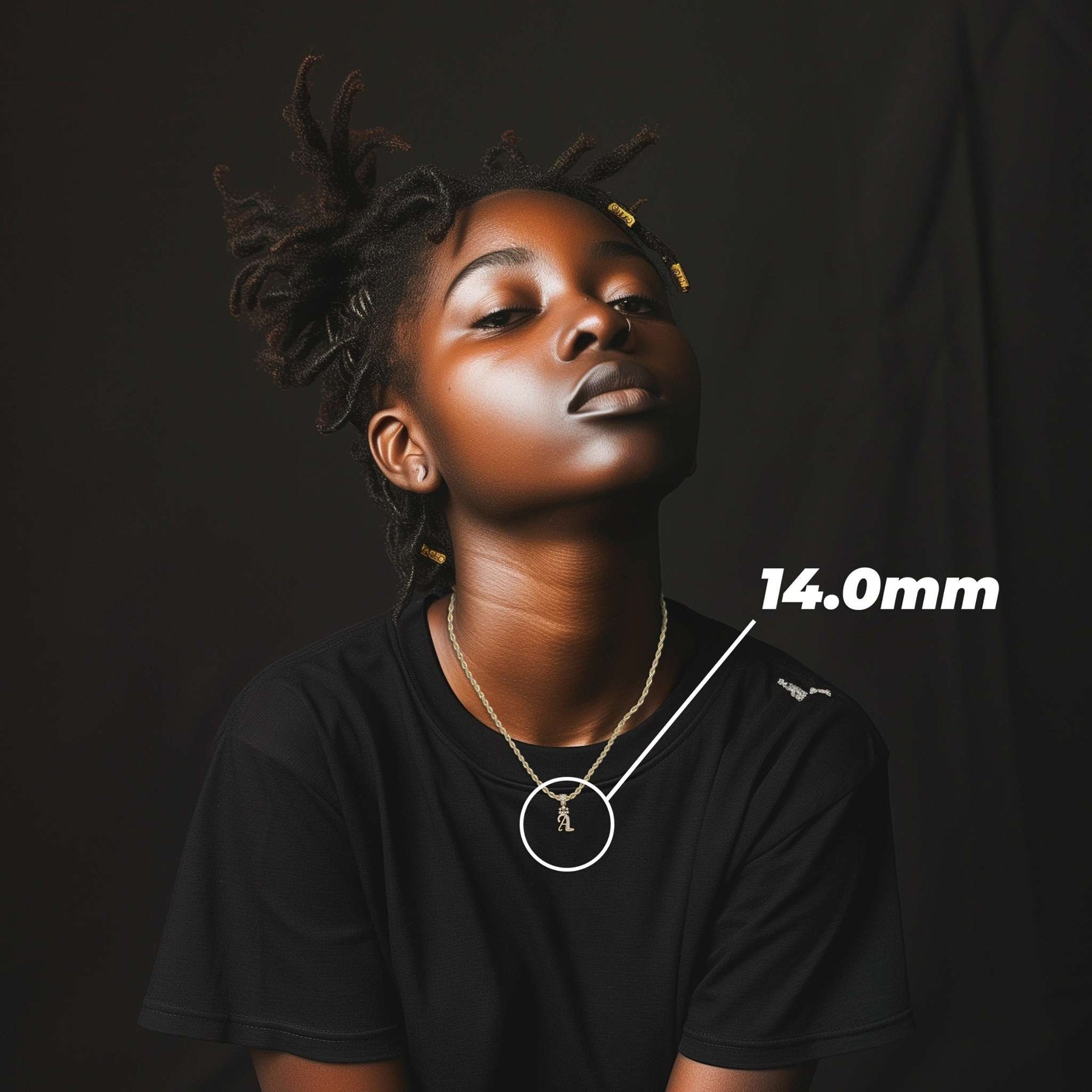 Model wearing the 10k gold cursive initial pendant with a 14.0mm size overlay.