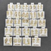 Complete alphabet set of 10k yellow gold cursive initial stud earrings featuring sparkling CZ crowns.