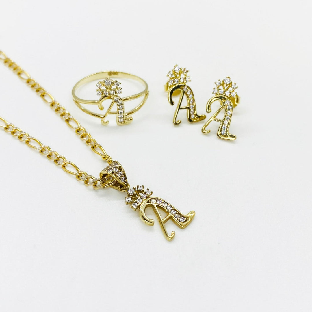 10k gold A initial collection including cursive stud earrings, matching ring, and gold pendant.