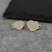 Two 10k gold heart rings of different sizes featuring pavé cubic zirconia stones.