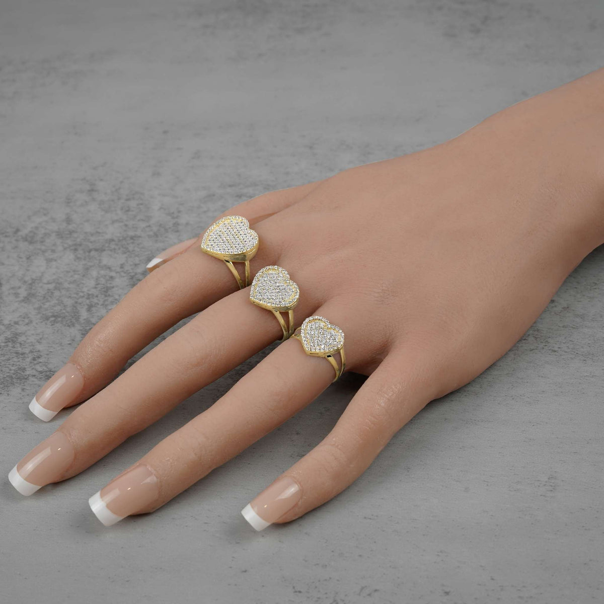 10k Gold Dazzling Heart White Cubic Zirconia Ring, on-hand size comparison view.