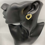 Elegant 10k solid gold heart-framed stud earring, diamond-cut rollie texture, displayed on mannequin.