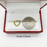 Small 13mm diamond-cut rollie heart stud earring shown next to a US quarter.