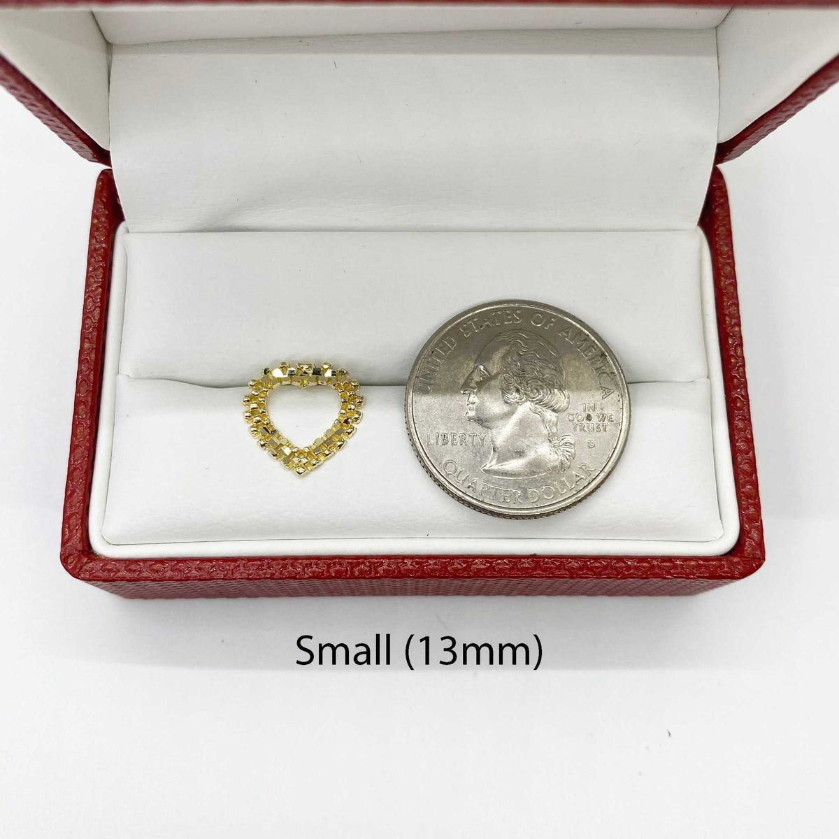 Small 13mm diamond-cut rollie heart stud earring shown next to a US quarter.