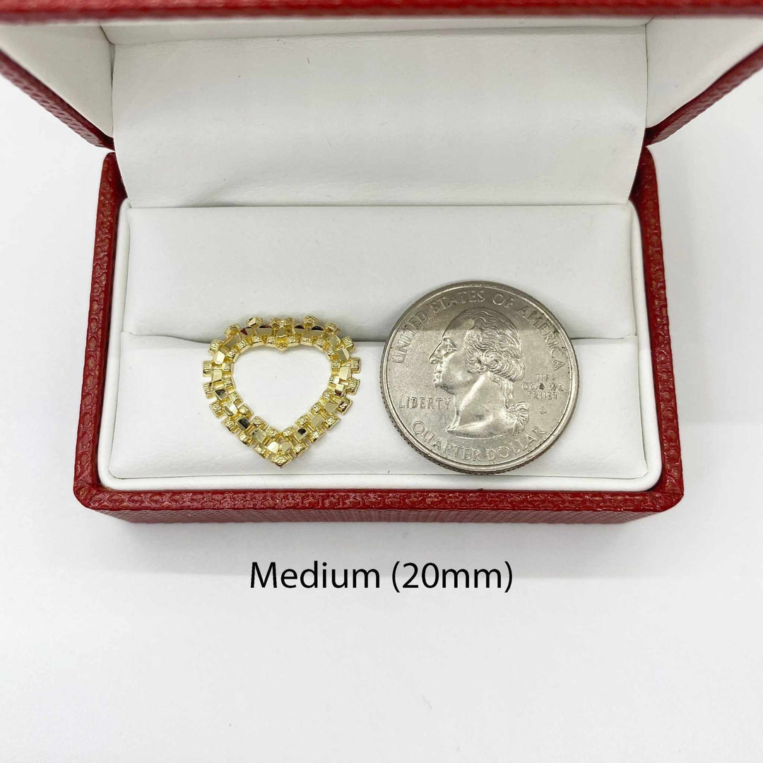 Medium 20mm diamond-cut rollie heart stud earring shown next to a US quarter.