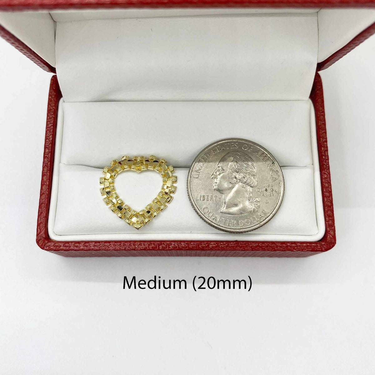 Medium 20mm diamond-cut rollie heart stud earring shown next to a US quarter.