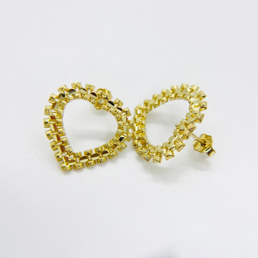 Pair of 10k yellow gold diamond-cut rollie style heart stud earrings.