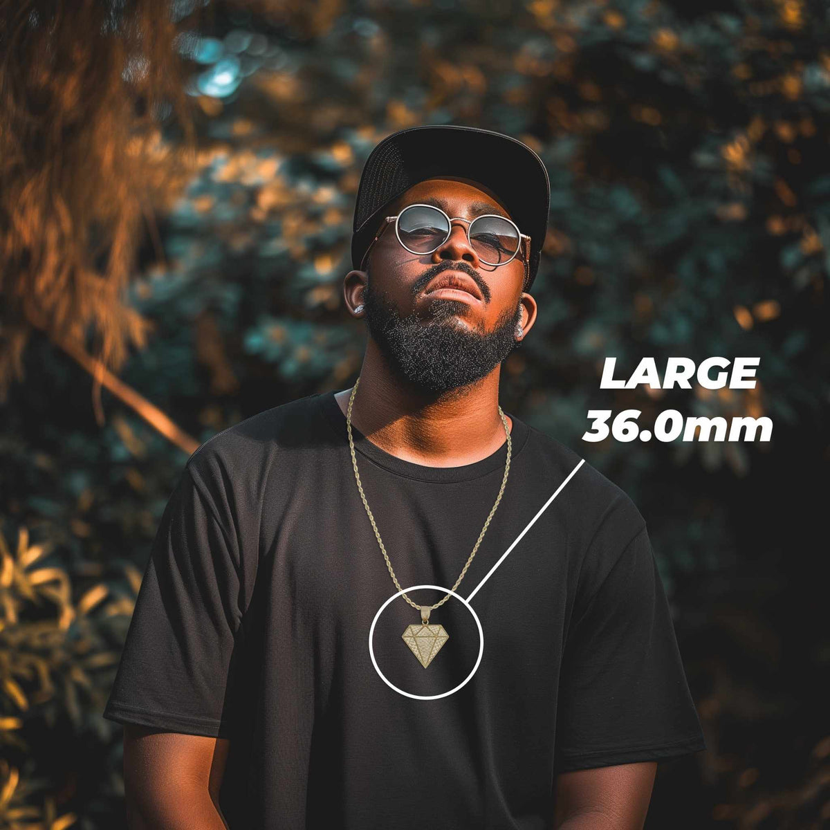 Man wearing sunglasses and a black t-shirt modeling a 36.0mm gold diamond pendant.
