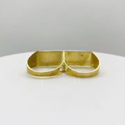 10k Gold double finger ring back view on a white plate with a gray background