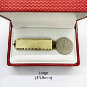 10k Gold Classic Flat Double Finger in a red jewelry box with a coin for scale on a white background